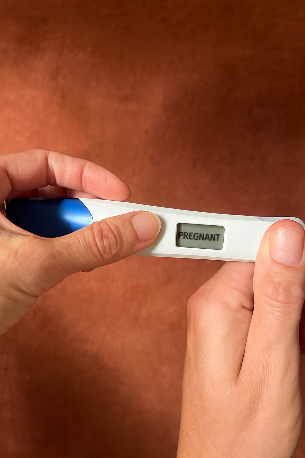 A closeup of a positive pregnancy test